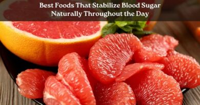 best foods that stabilize blood sugar naturally, including leafy greens, avocado, raw nuts, eggs, lentils, and berries arranged on a rustic kitchen table.